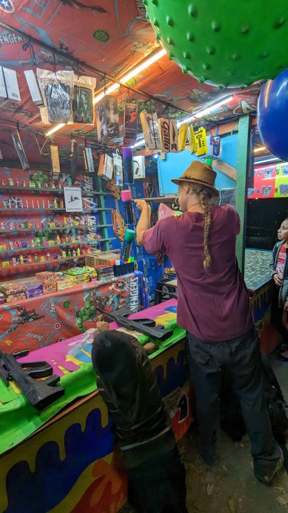 Dan winning the marksmanship game.